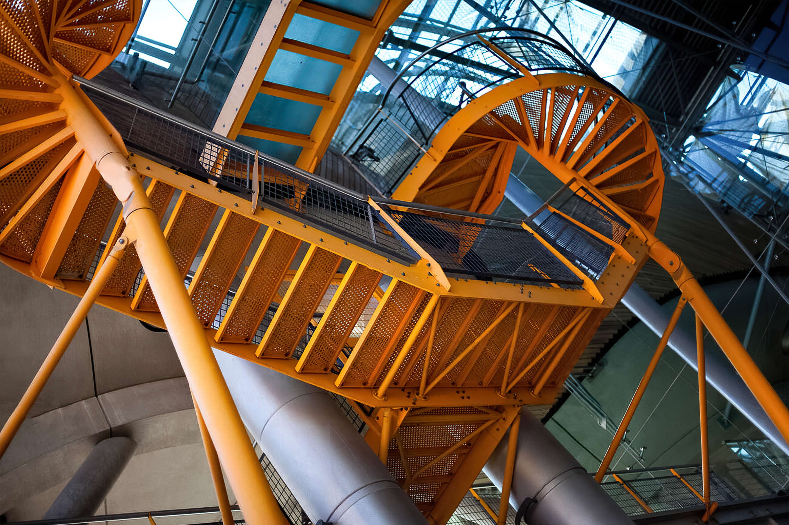 Orange spiral staircase sprayed in place