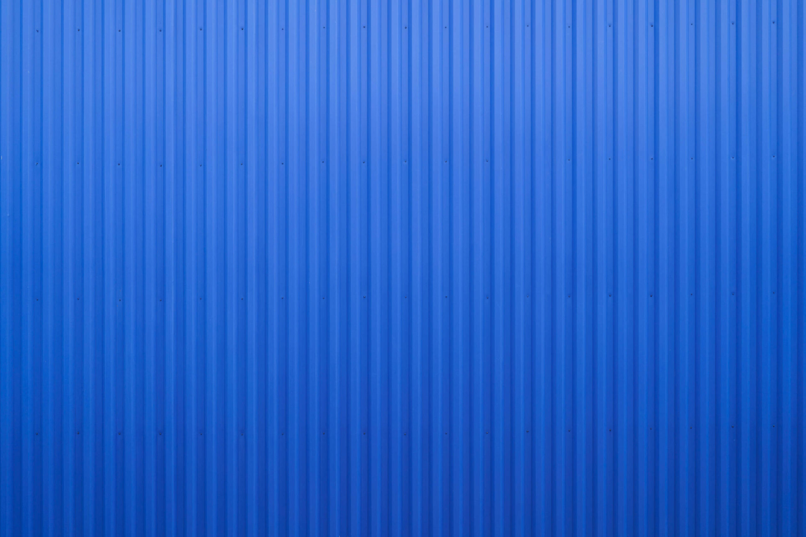 Industrial steel wall sprayed in deep blue