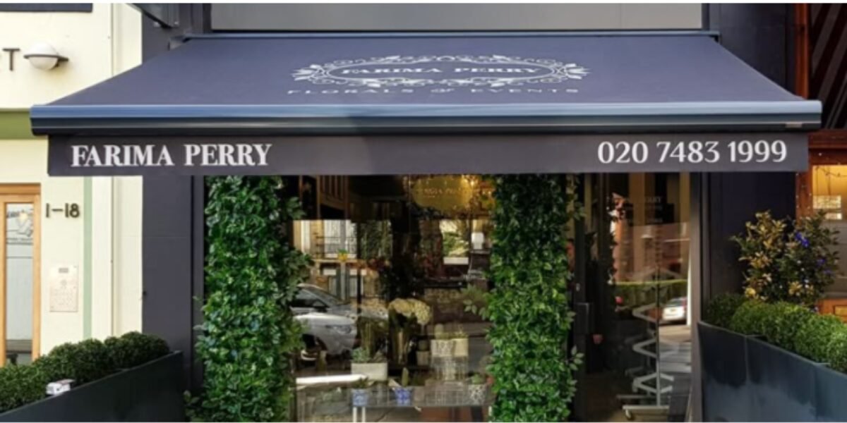 Resprayed shop front with awning and planted frontage