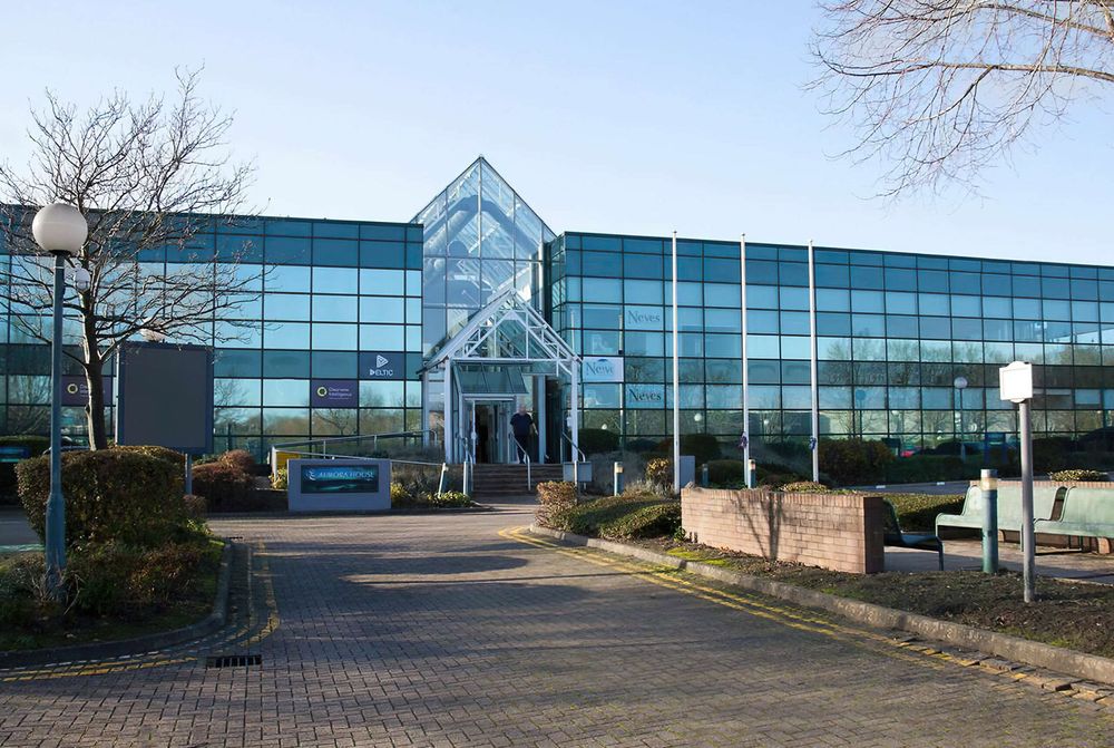 Curtain walling and façade framing resprayed on a commercial building